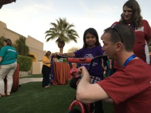 Child Receiving a Bike from The Leader's Institute